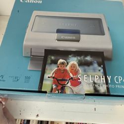 Compact photo printer by Canon, model Selphy CP400.