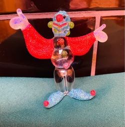 So cute! Vintage handmade art glass clown with glitter components throughout.