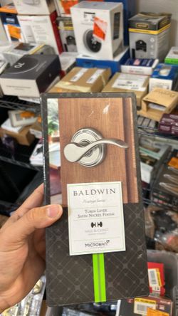 Baldwin Prestige Series Tobin Lever in a satin nickel finish for hall and closet doors.