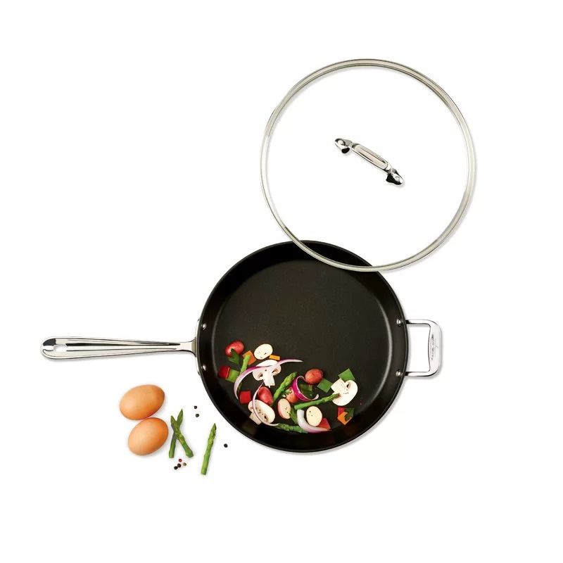{ONE} All clad hal0?o 12” nonstick frying pan with lid. Overall: 22.5” W x 5” H. Avoid metal utensils. Dishwasher safe. MSRP: $160. Our price: $65 + S