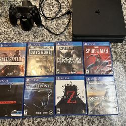 PS4 With One Control, Charging Station, And 8 Games