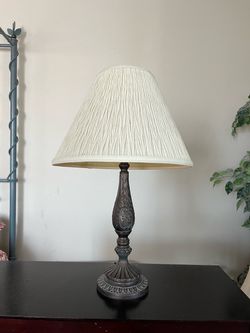 Table lamp with dark bronze finish