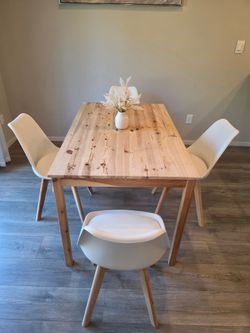 Brown Wooden Table and 4 White Chairs with Attached Padding