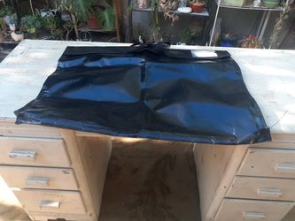 heavy-duty, waterproof vinyl protective cover or utility bag,