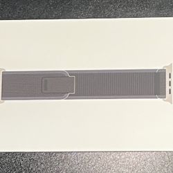 Genuine Apple Watch Band Trail Loop (49mm) in Blue/Black with a rugged titanium finish is a high-quality strap designed for the Apple Watch Ultra 