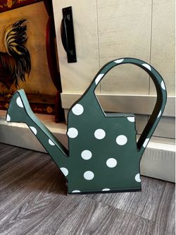 Green and white wood watering can