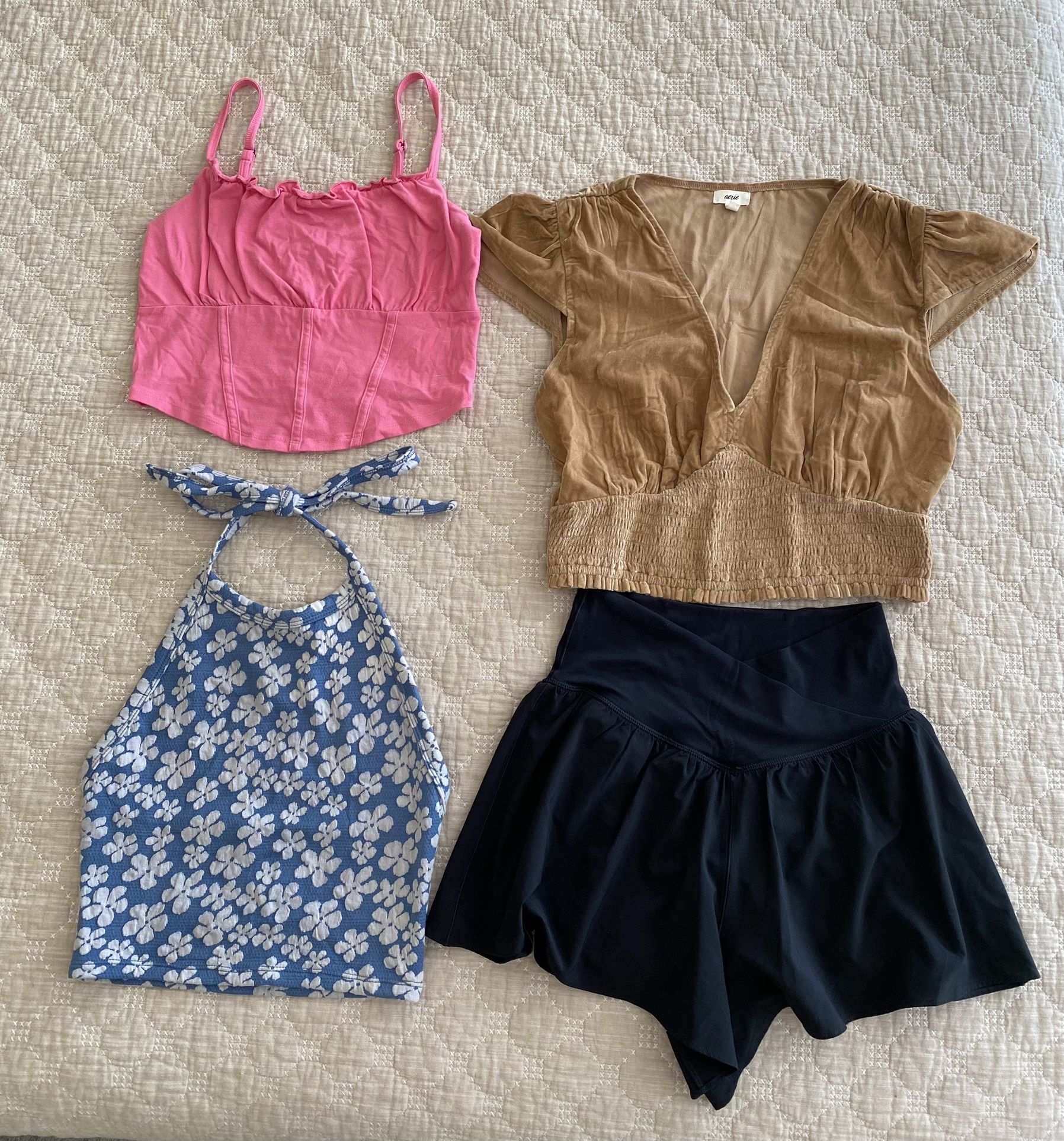Three Women’s Tops With A Pair Of Shorts