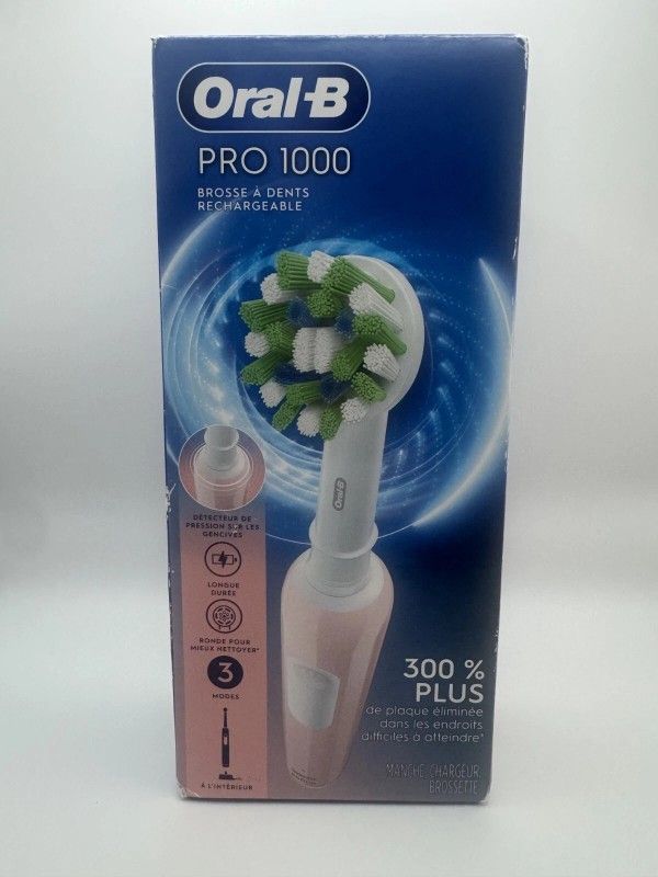 Oral-B Pro 1000 CrossAction Electric Toothbrush Powered by Braun Pink