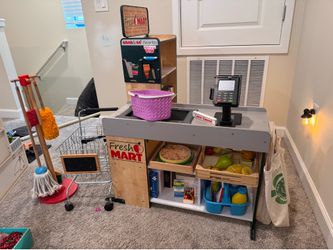 Grocery store with apron, basket, shopping cart, and accessories