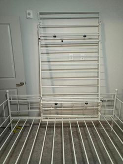 Metal daybed with a pull-out trundle bed.