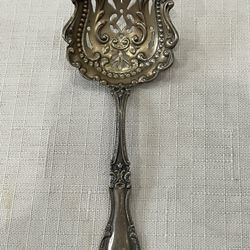 Blackinton sterling silver sugar sifter spoon with ornate filigree and pierced bowl. A003