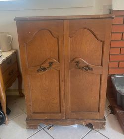 Vintage Wooden Storage Cabinet with Detailed Handles