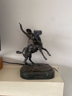 C.M Russell Signed Bronze Cowboy on Horse