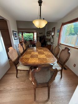 Wood Dining Table with 8 Cane Back Chairs