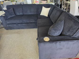 Brand new 90" x 90" black corduroy sectional with sofa sleeper and storage chaise