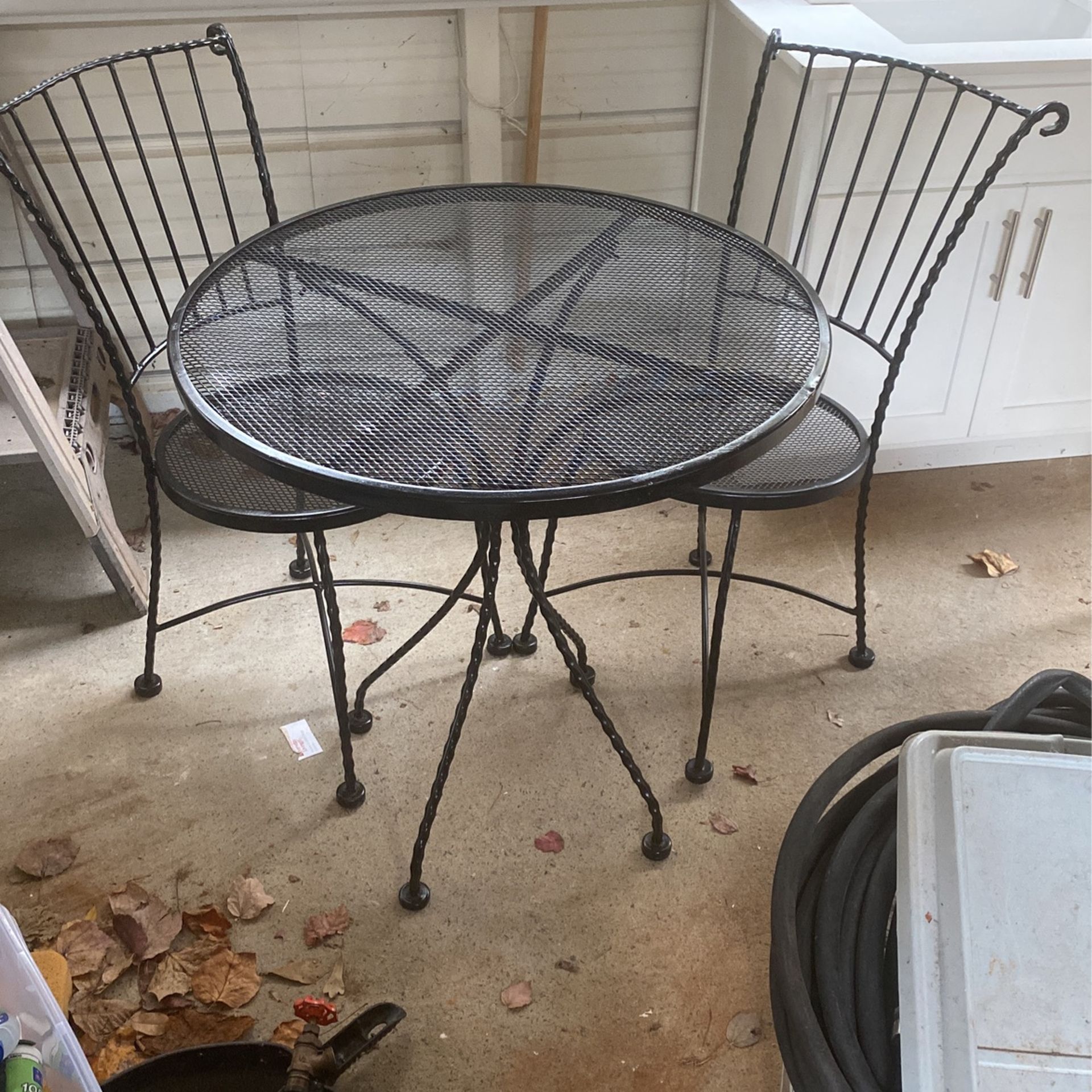 Metal Table With Two Metal Chairs