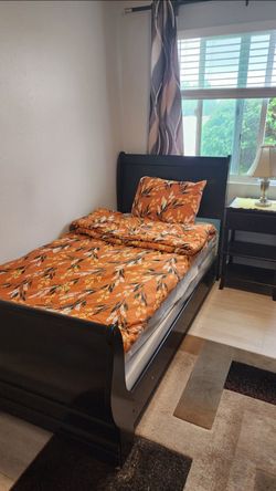 Twin bed frame with a mattress