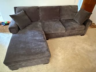 Grey L shape sofa.
