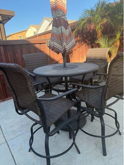 Patio table with 4 chairs and umbrela