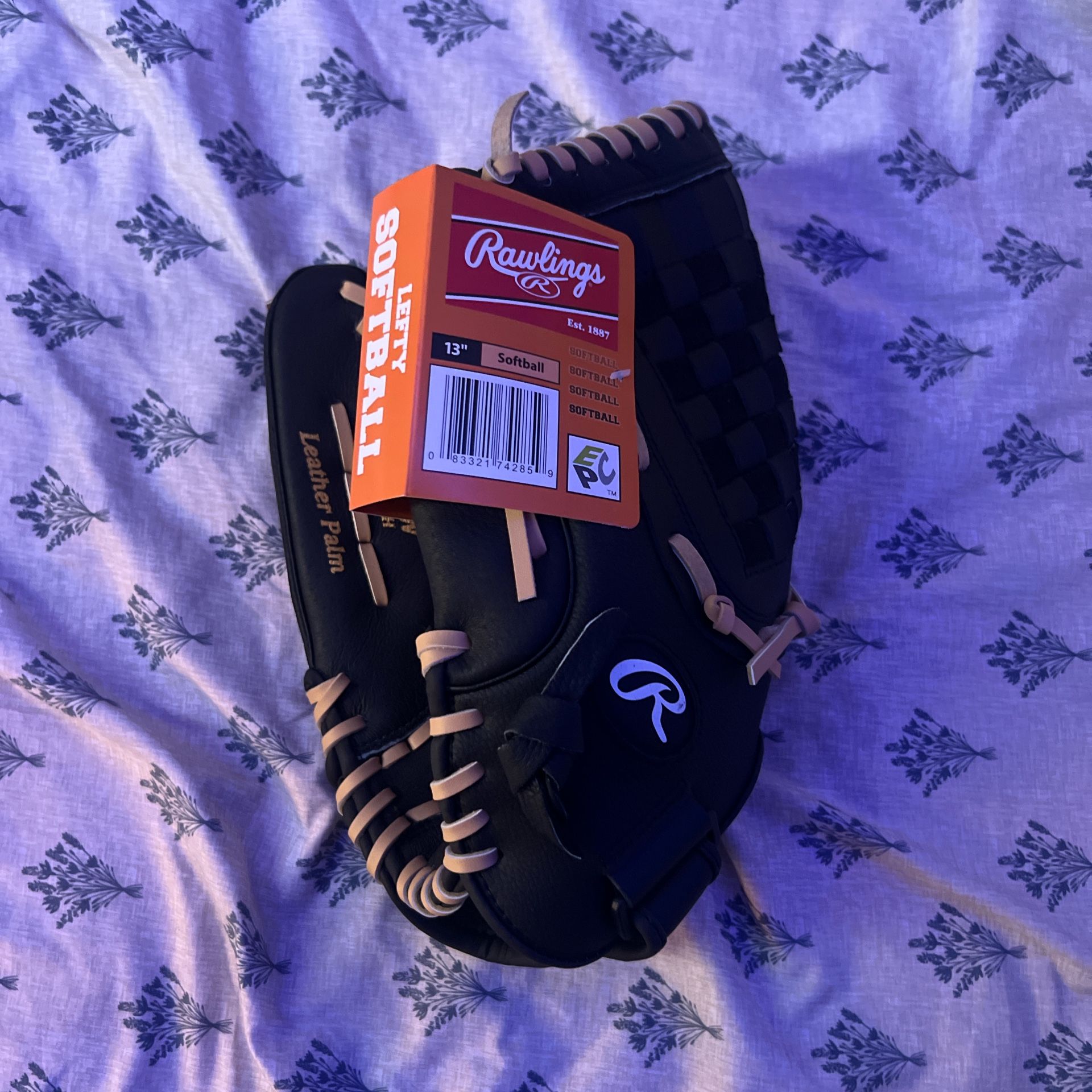 Black and gold Rawlings softball/baseball glove