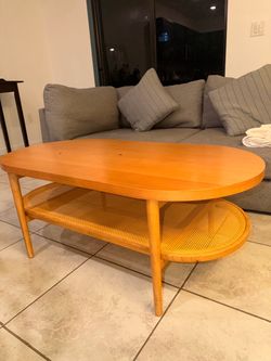 Oval Wood Coffee Table with Cane Shelf