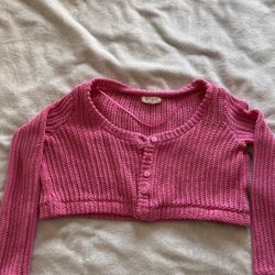 Cropped pink knitted sweater 