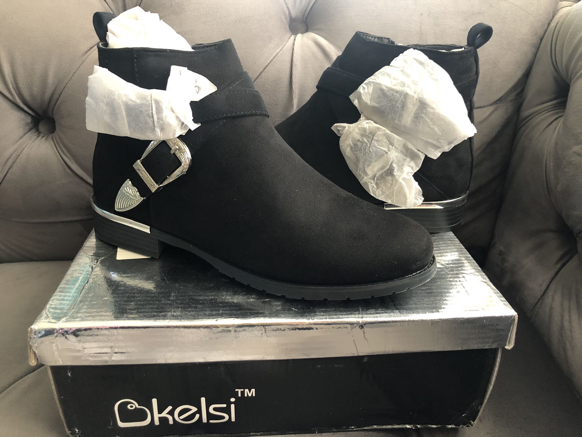 New black booties with silver buckle