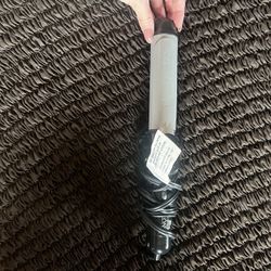 Revlon curling iron. Works perfect 