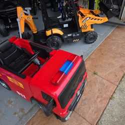 Ride on cars, tractor and firetruck 2 for $200