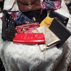 12 Bundles Or Pre-loved Clutch And Wristlet In Excellent To Normal Signs Of Use . 
