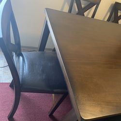 dining table for six people with six chair and couch 