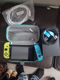 Nintendo Switch with Neon Joy-Cons and Accessories
