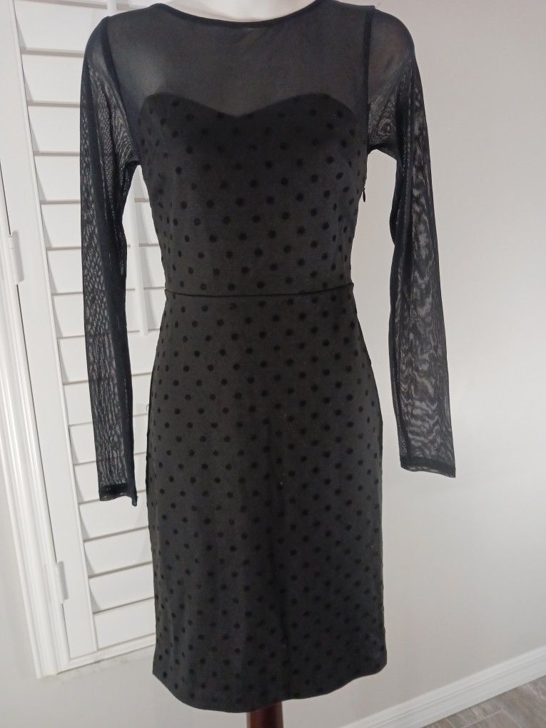 BLACK LONG SLEEBE SHEER SLEEVES AND UPPER PORTION OF THE DRESS Xs Bodice Has Pokadot Look 76% Polyestet 20 % Rayo 4 %spandex. The Limited.