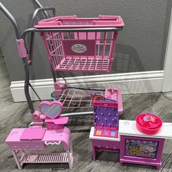 Shopping cart,  Barbie camper and a couple Playsets