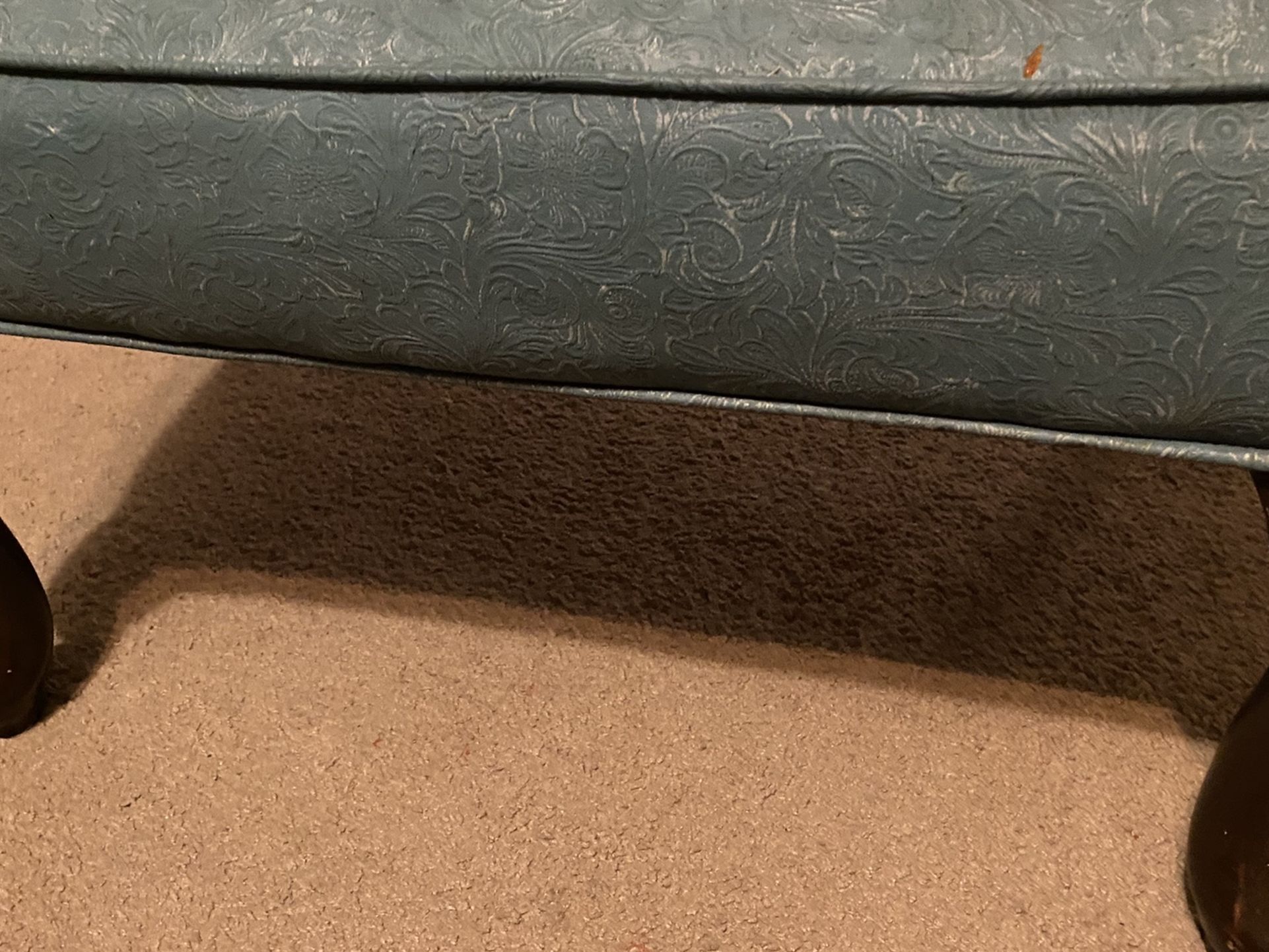 Turquoise or light blue stool or ottoman with brown wooden legs!