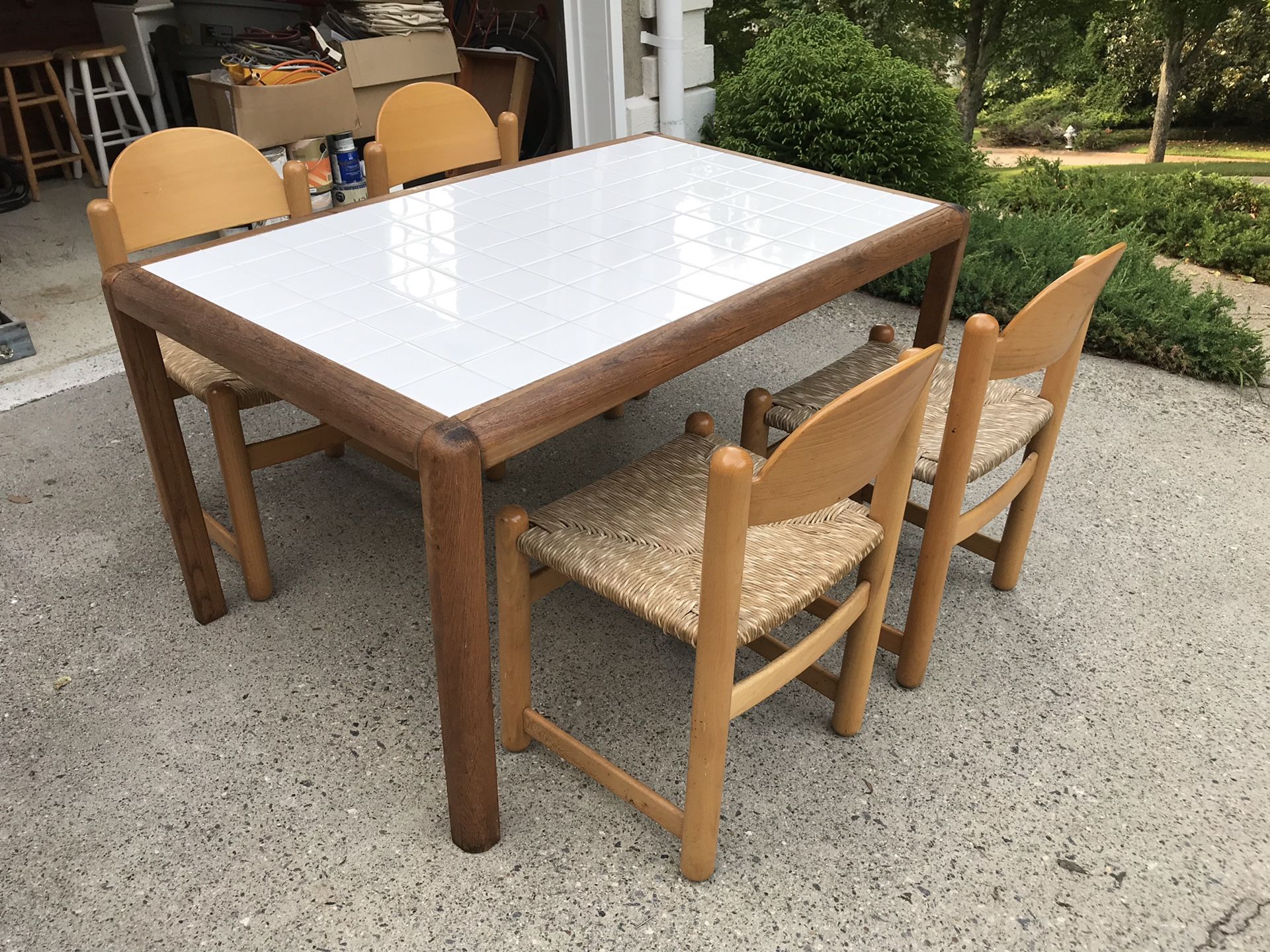 Storehouse white tiled kitchen table and 4 wicker chairs.