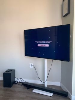 this is a 55-inch Samsung Q70A/Q77A Series 4K QLED Smart TV with speaker and subwoofer.