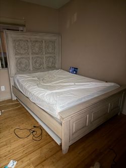 queen size bed frame mattress and dresser with removable doors.