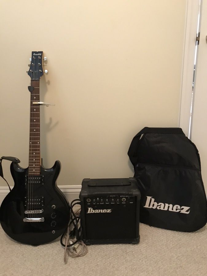 Ibanez electric guitar, amplifier, cords, and case