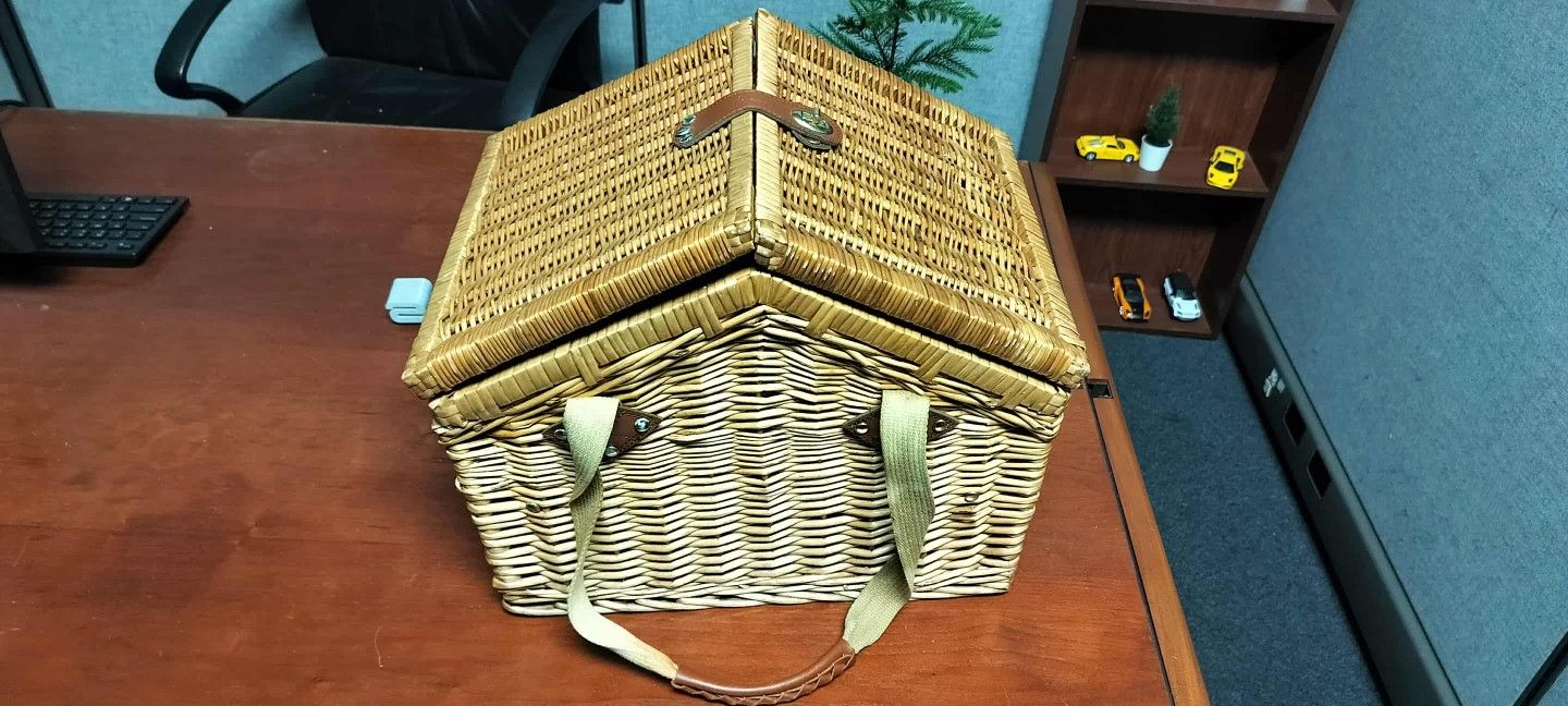 Picnic time large wicker picnic basket with plates, cups, full silverware, napkins, and various utensils
