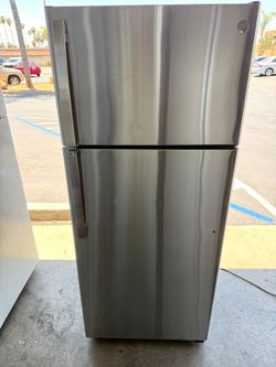 GE stainless steel apartment size refrigerator and top freezer