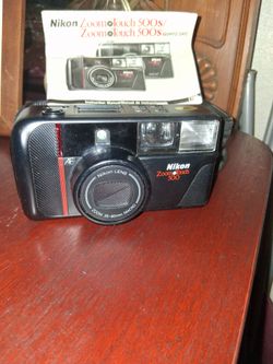 Nikon Zoom Touch 500 in excellent working condition with black travel bag..$10obo