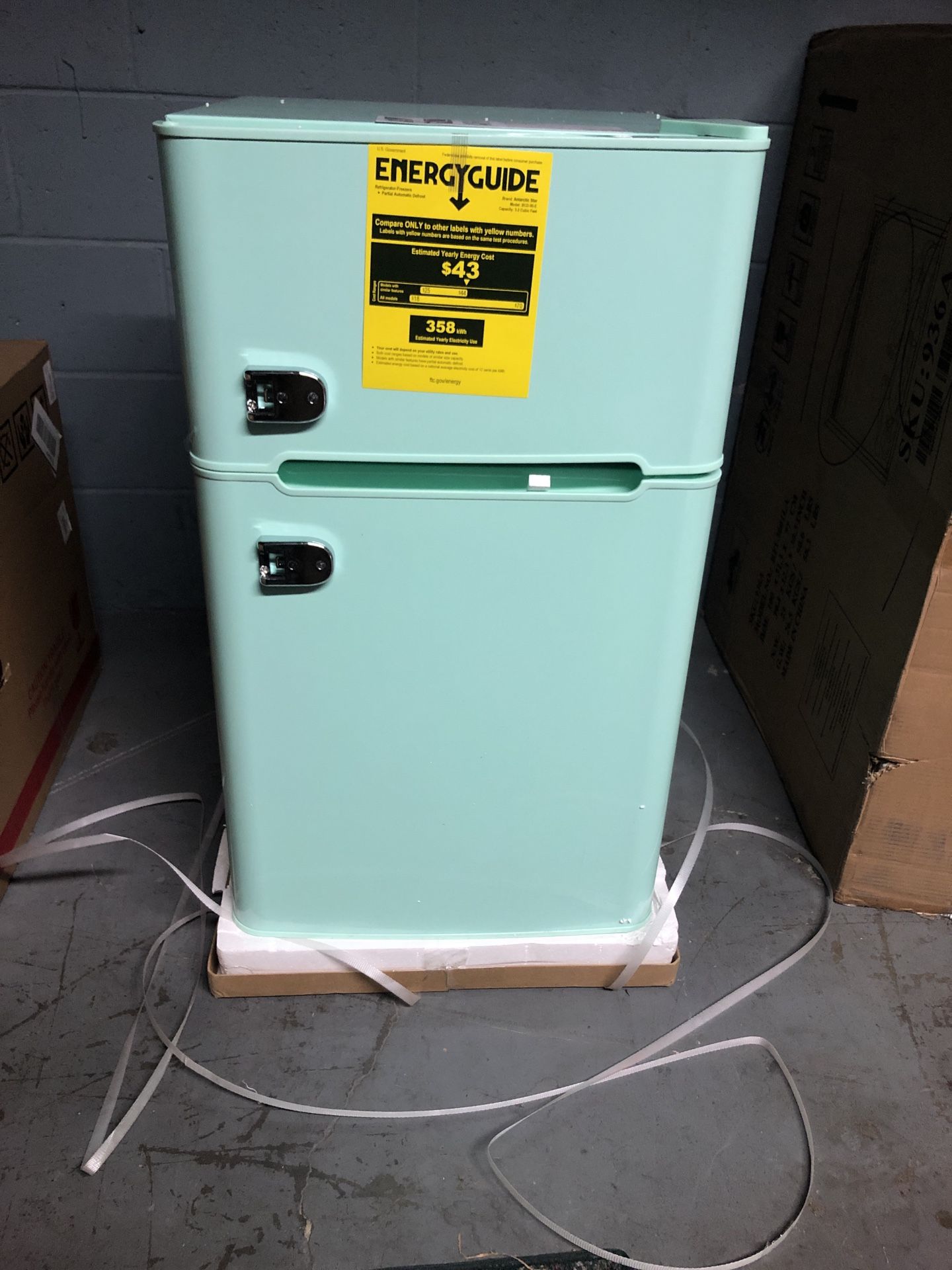 Compact Mini Refrigerator with Separate Freezer in the box with small dent on one side