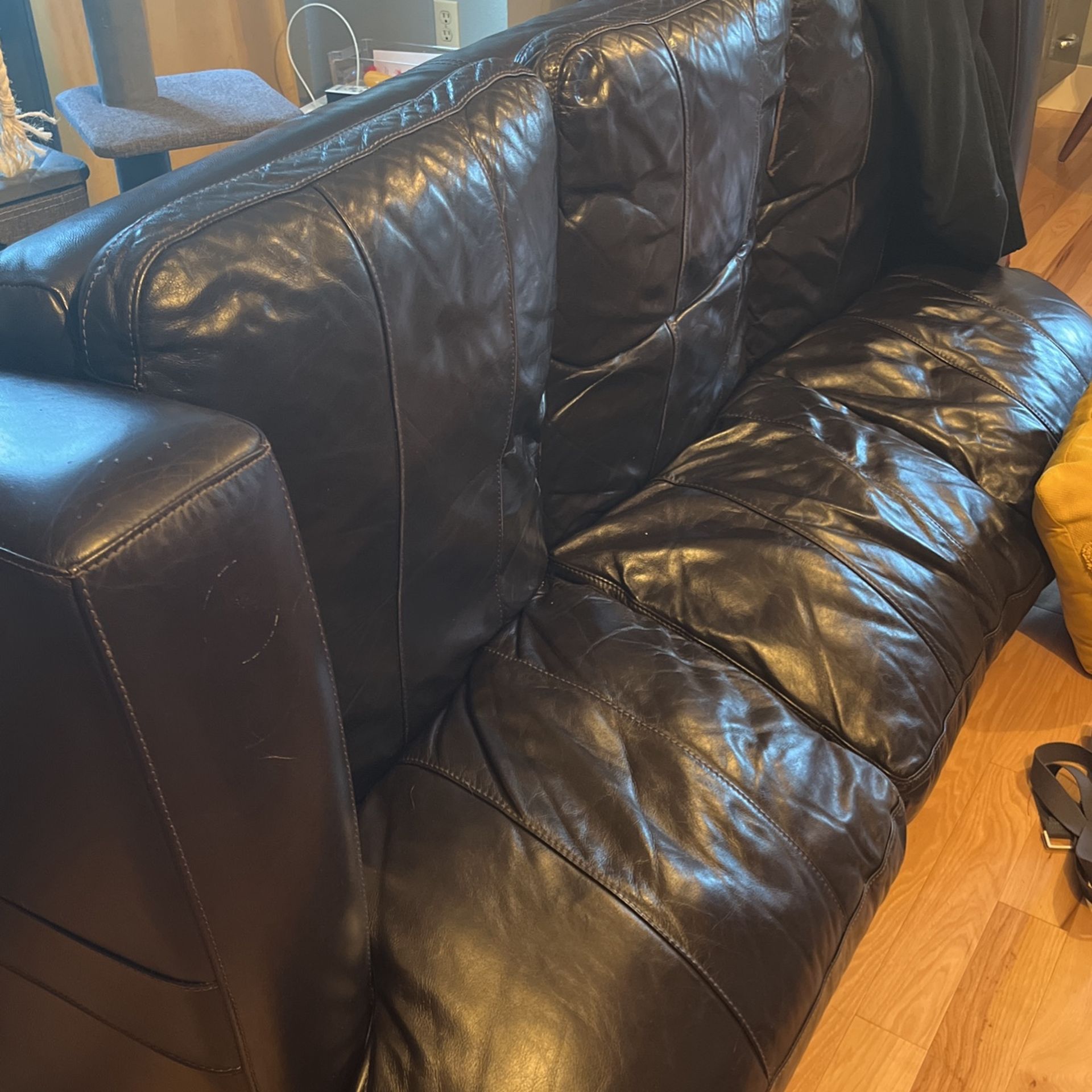 Nice leather couch. Black. Free.