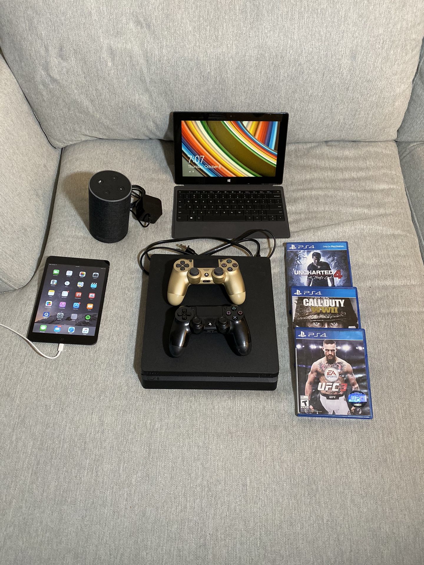 IPad, Surface Pro, Amazon echo and PS4 with 3 games and controllers