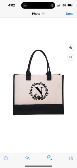 Elevate your daily style with this chic personalized monogram tote bag. Crafted from durable canvas with a classic black and white design, this tote f