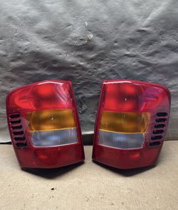 #OT107 99-04 Jeep Grand Cherokee Red Halogen Tail Light Pair 