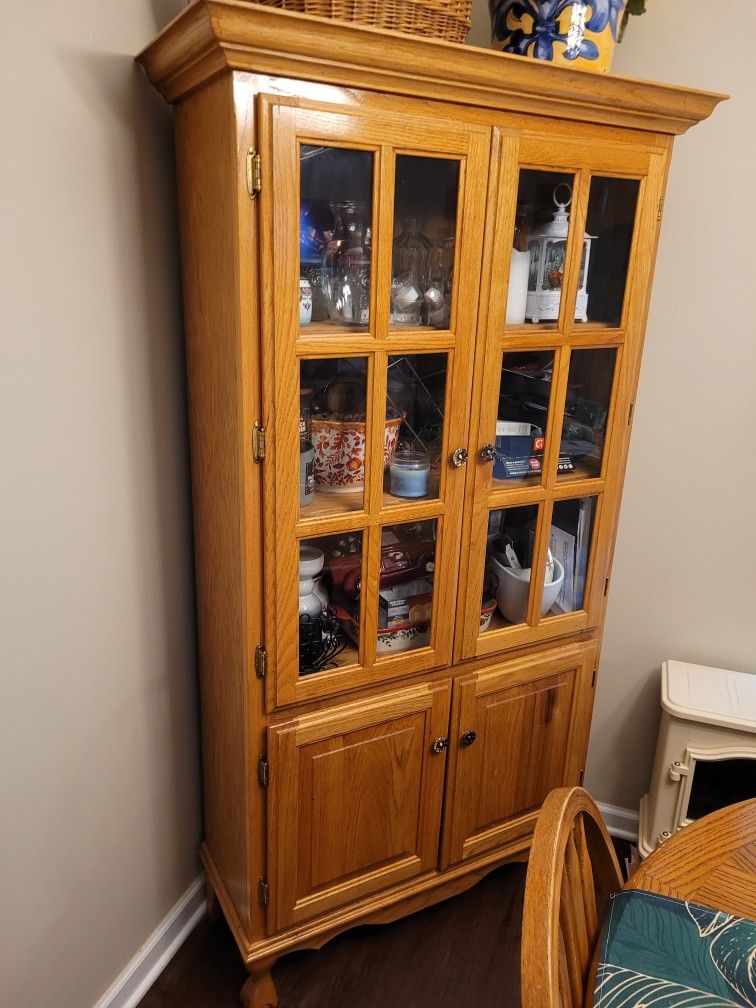 Table With Center Extension And Corner Hutch Cabinet.