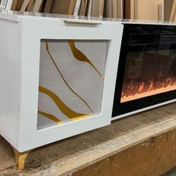STAND TV WITH FIREPLACE WHITE AND GOLD 