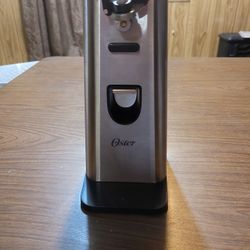 Oyster stainless steel can opener with retractable cord.